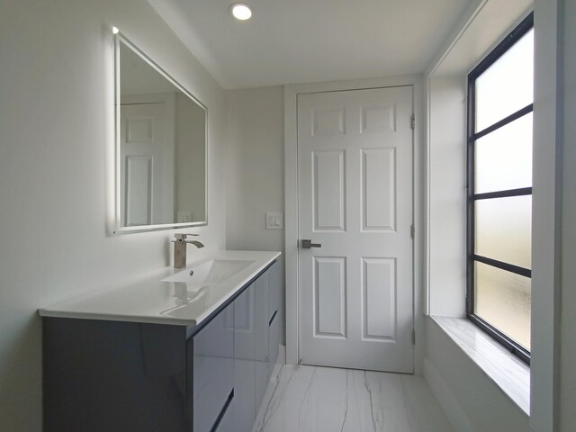 7240 Huntington Ln Unit 408, Delray Beach, FL 33446 - bathroom featuring marble finish flooring, vanity, and recessed lighting