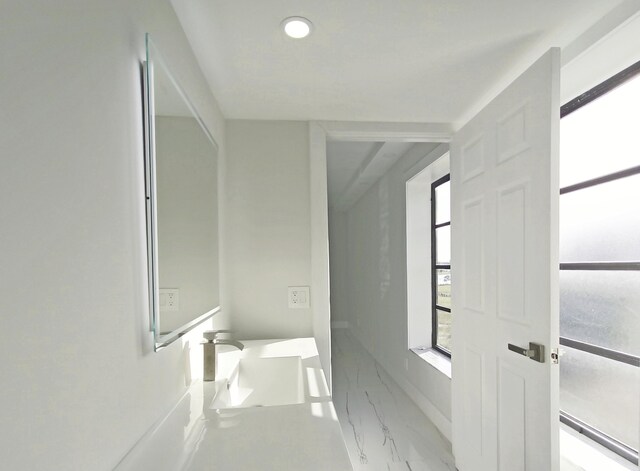 7240 Huntington Ln Unit 408, Delray Beach, FL 33446 - bathroom featuring marble finish floors, a sink, and recessed lighting