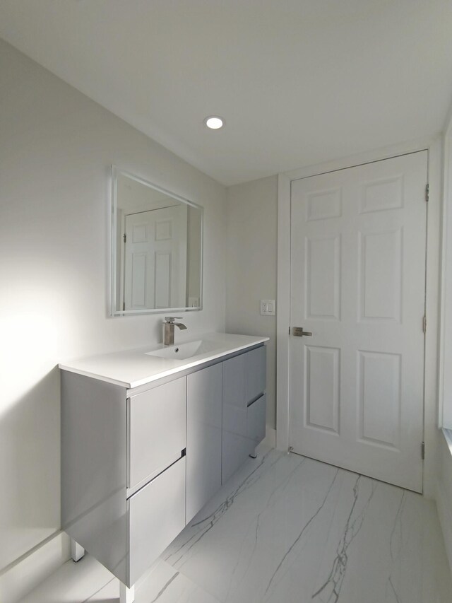 7240 Huntington Ln Unit 408, Delray Beach, FL 33446 - bathroom with vanity, marble look tiles, and recessed lighting