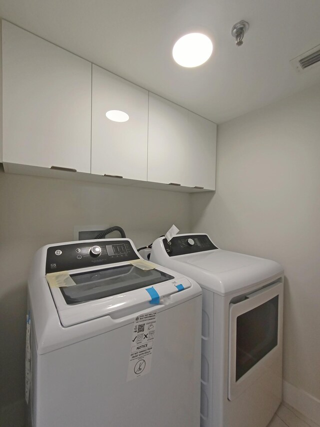 7240 Huntington Ln Unit 408, Delray Beach, FL 33446 - laundry room with independent washer and dryer and cabinet space