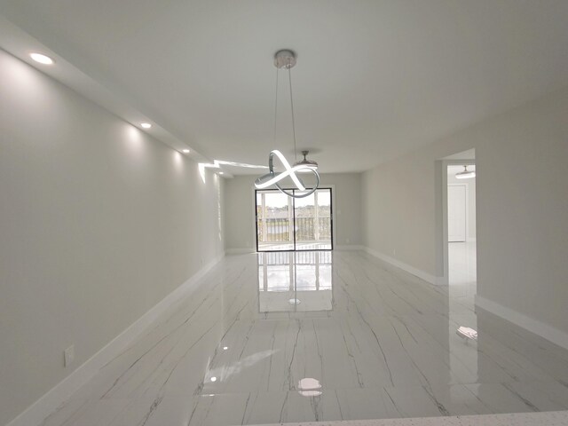 7240 Huntington Ln Unit 408, Delray Beach, FL 33446 - unfurnished room with light marble finish floors, recessed lighting, and baseboards