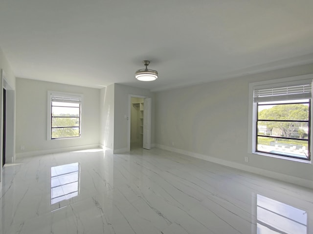 7240 Huntington Ln Unit 408, Delray Beach, FL 33446 - empty room with light marble finish floors and baseboards