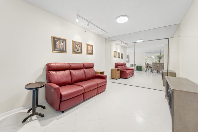 14112 Huntington Pointe Dr Unit 105, Delray Beach, FL 33484 - living room featuring rail lighting