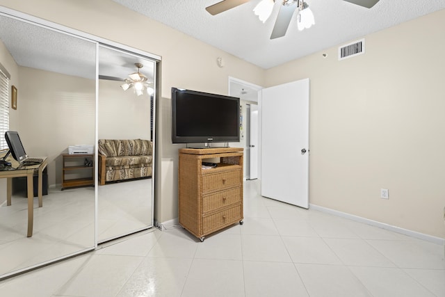 14112 Huntington Pointe Dr Unit 105, Delray Beach, FL 33484 - bedroom featuring light tile patterned floors, visible vents, and a textured ceiling