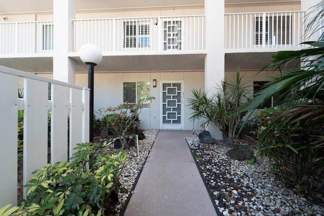 14112 Huntington Pointe Dr Unit 105, Delray Beach, FL 33484 - entrance to property featuring stucco siding and a balcony