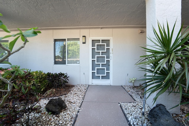 14112 Huntington Pointe Dr Unit 105, Delray Beach, FL 33484 - property entrance with stucco siding