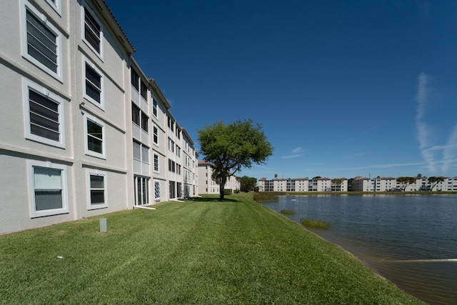 14112 Huntington Pointe Dr Unit 105, Delray Beach, FL 33484 - view of property's community featuring a yard and a water view