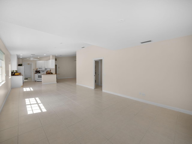 unfurnished living room featuring light tile patterned flooring, visible vents, baseboards, recessed lighting, and ceiling fan