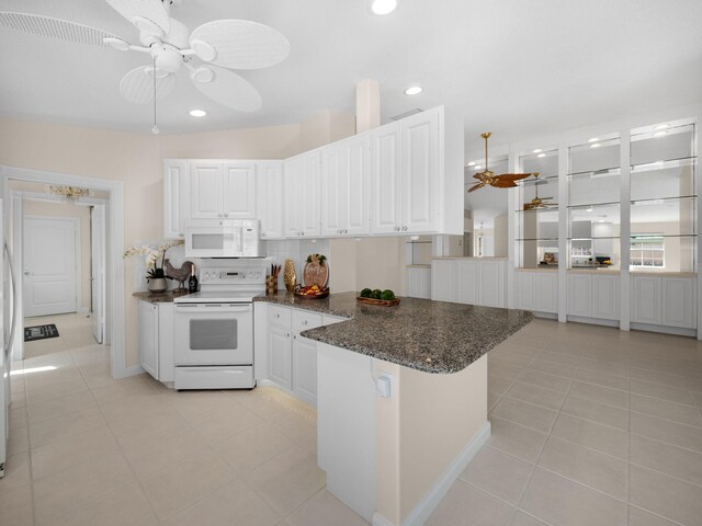 kitchen with white cabinets, a ceiling fan, white appliances, and light tile patterned floors