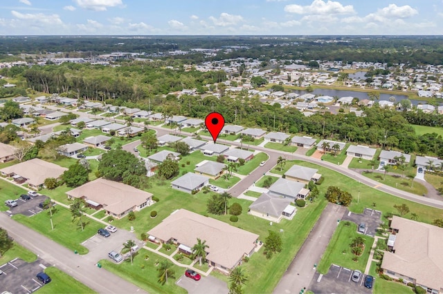 bird's eye view with a residential view and a water view