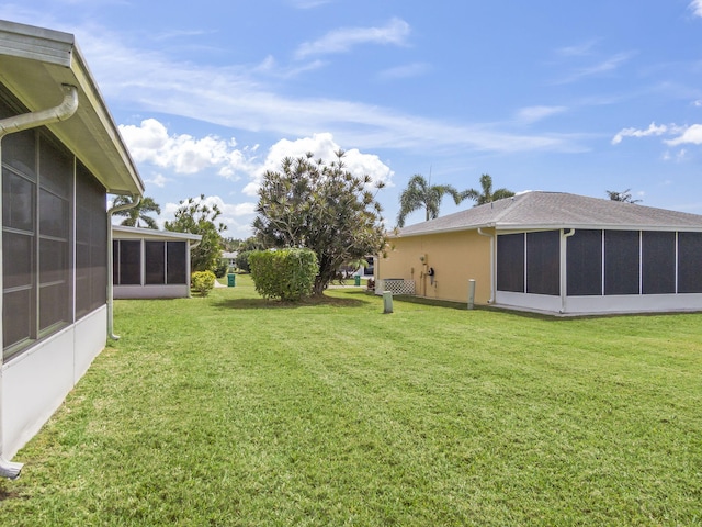view of yard featuring a sunroom
