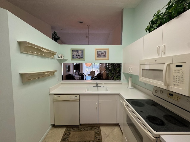 kitchen featuring white cabinetry, white appliances, light countertops, and a sink