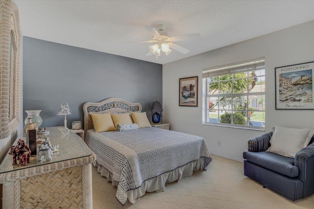 bedroom featuring baseboards, carpet flooring, a textured ceiling, and a ceiling fan