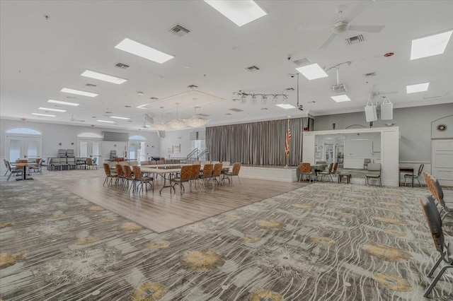unfurnished dining area featuring a ceiling fan and visible vents