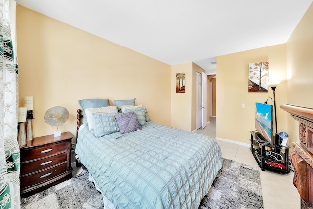 bedroom featuring light tile patterned floors