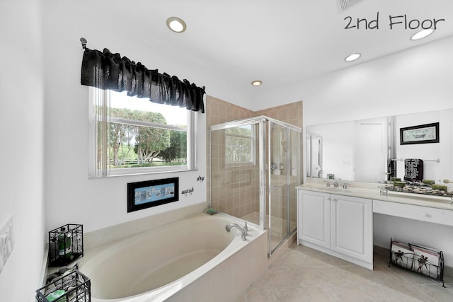 bathroom with recessed lighting, vanity, a bath, tile patterned floors, and a stall shower