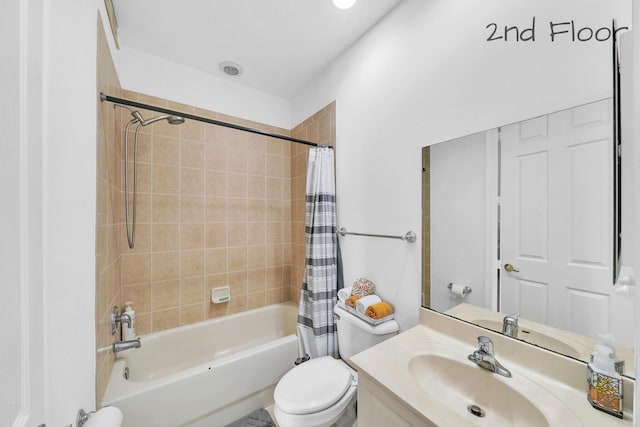 full bath featuring shower / tub combo, toilet, and vanity
