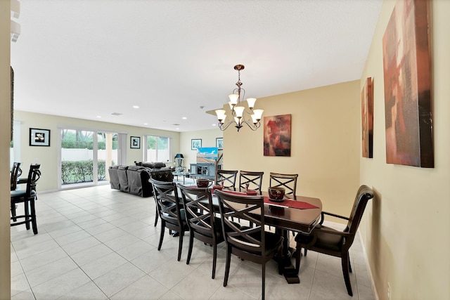 dining room featuring light tile patterned floors, recessed lighting, a chandelier, and baseboards