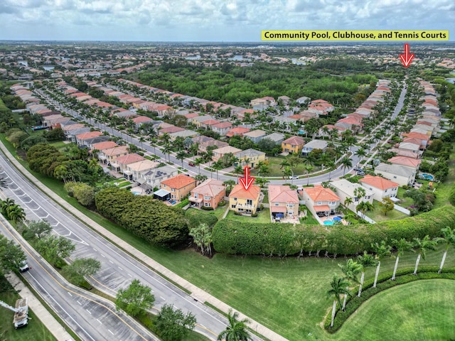 birds eye view of property with a residential view