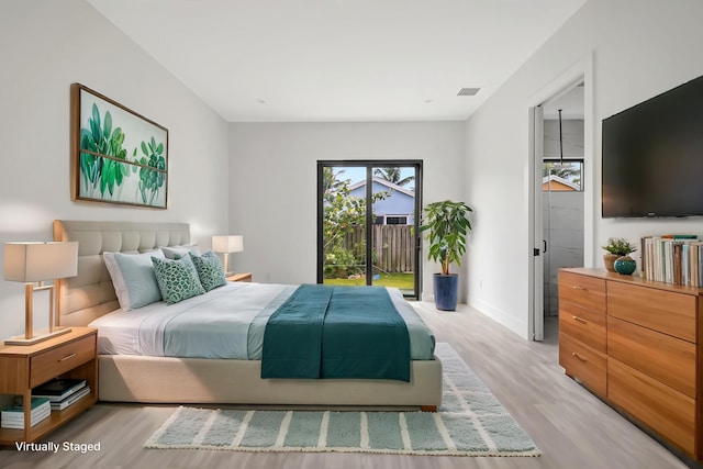 bedroom featuring visible vents, access to exterior, baseboards, and light wood-style flooring