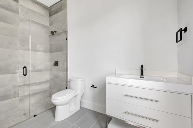 full bath featuring tile patterned floors, a stall shower, and vanity