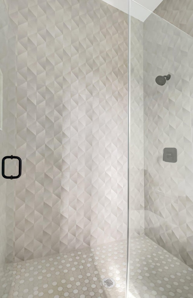 bathroom featuring a shower stall