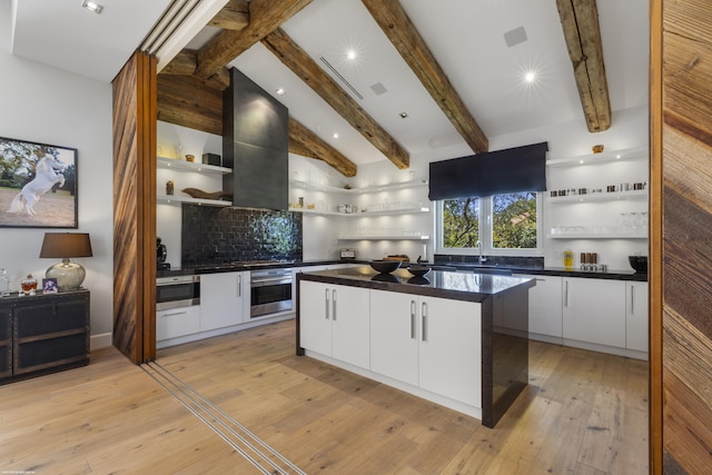 kitchen featuring open shelves, dark countertops, white cabinets, and appliances with stainless steel finishes