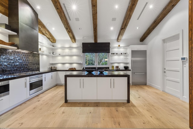 kitchen with white cabinets, open shelves, stainless steel appliances, and a kitchen island