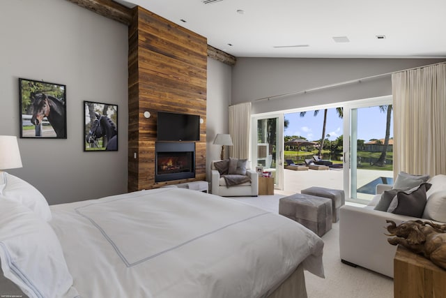 bedroom with a fireplace, access to exterior, high vaulted ceiling, and light carpet