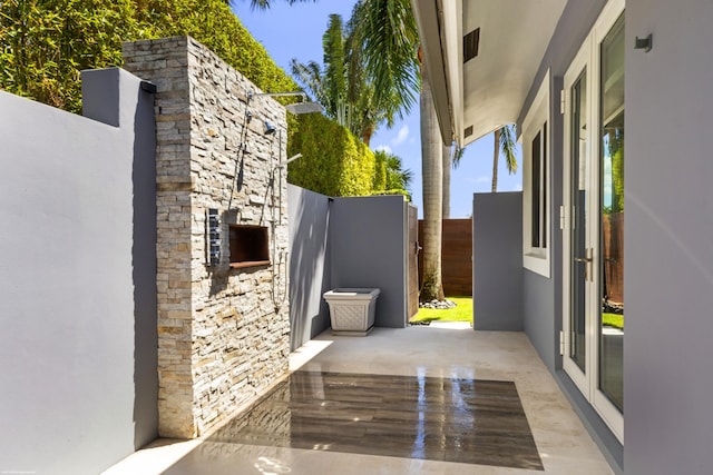view of patio featuring fence