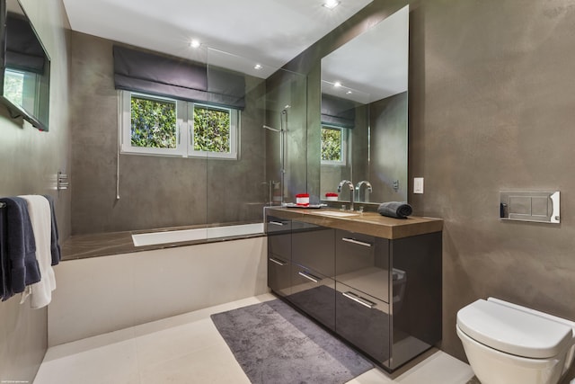 bathroom featuring tile patterned floors, vanity, shower / tub combination, and toilet