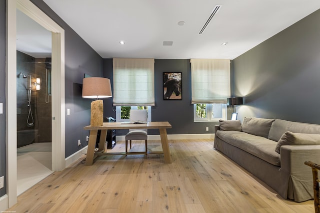 home office with wood-type flooring, baseboards, visible vents, and recessed lighting