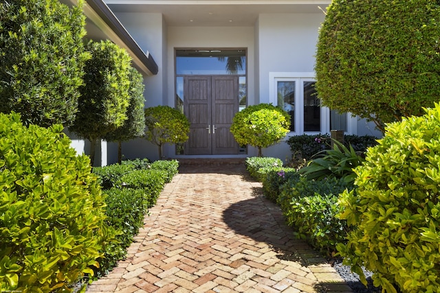 doorway to property with stucco siding