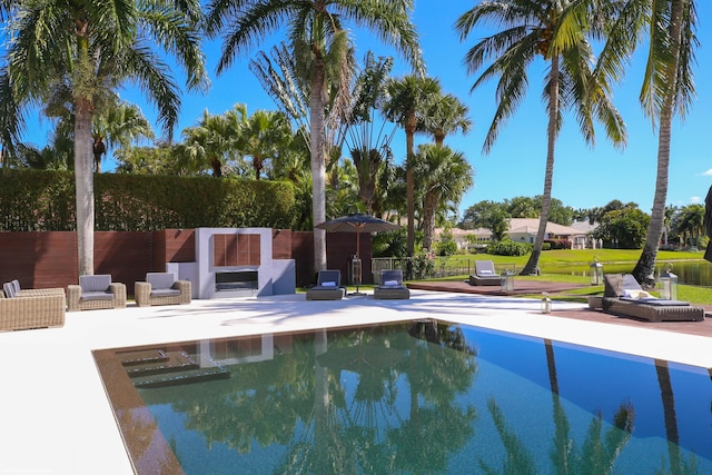 view of swimming pool with fence, a patio area, and a fenced in pool