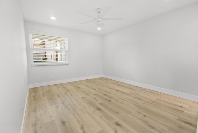 empty room with baseboards, ceiling fan, recessed lighting, and wood finished floors