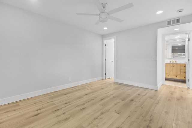 unfurnished bedroom with connected bathroom, recessed lighting, visible vents, and light wood-type flooring