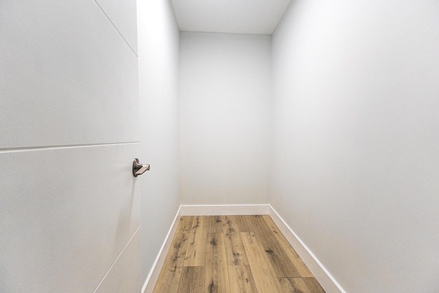 interior space featuring light wood-style floors and baseboards