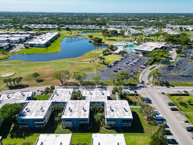 bird's eye view featuring a water view and view of golf course