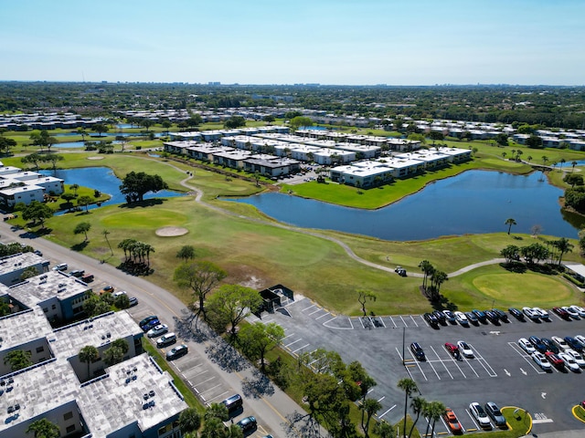 bird's eye view with a water view and golf course view