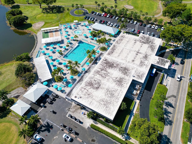 bird's eye view with view of golf course and a water view