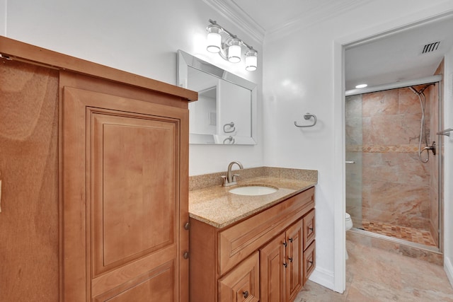 bathroom featuring crown molding, vanity, a shower stall, and toilet