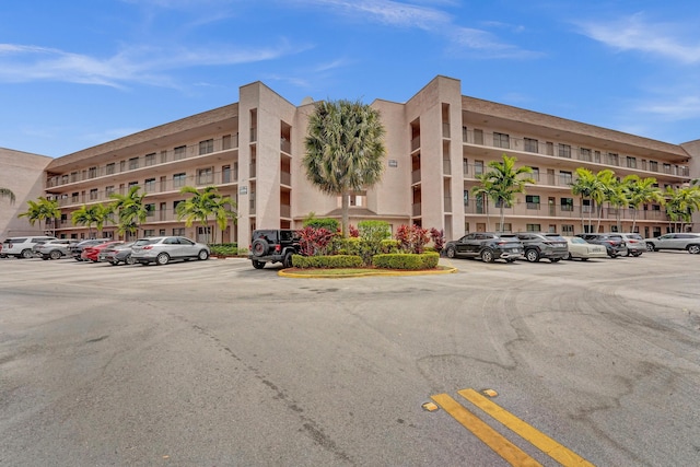 view of property with uncovered parking