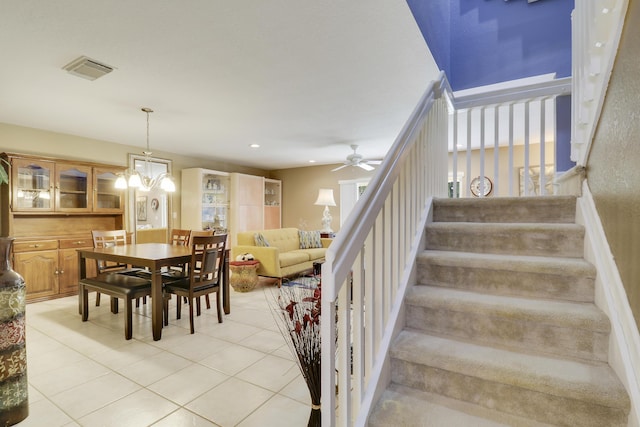 6170 Sugar Loaf Ln, West Palm Beach, FL 33411 - stairs featuring recessed lighting, tile patterned flooring, visible vents, and ceiling fan with notable chandelier