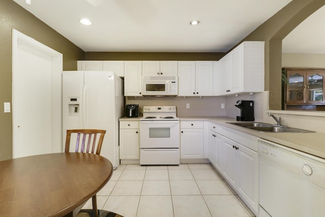 6170 Sugar Loaf Ln, West Palm Beach, FL 33411 - kitchen with recessed lighting, white appliances, light countertops, white cabinets, and a sink