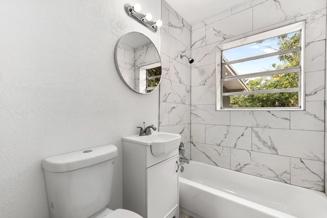 1134 NW 18th Ave, Fort Lauderdale, FL 33311 - bathroom with toilet, vanity, a textured wall, and shower / bathing tub combination