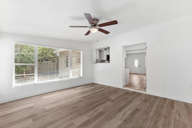 1134 NW 18th Ave, Fort Lauderdale, FL 33311 - interior space with baseboards, wood finished floors, and a ceiling fan