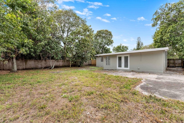 1134 NW 18th Ave, Fort Lauderdale, FL 33311 - view of yard with a fenced backyard and french doors