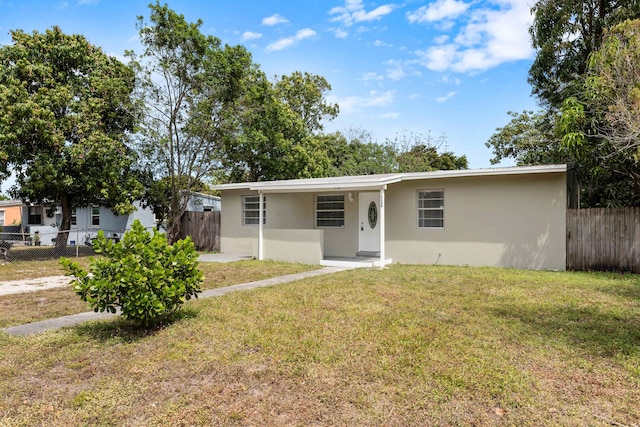 1134 NW 18th Ave, Fort Lauderdale, FL 33311 - single story home featuring stucco siding, fence, and a front lawn