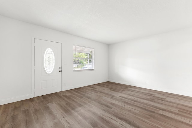 1134 NW 18th Ave, Fort Lauderdale, FL 33311 - entrance foyer featuring baseboards and wood finished floors