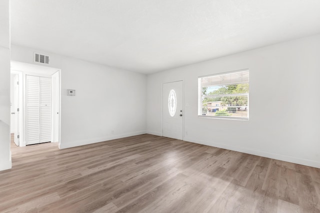 1134 NW 18th Ave, Fort Lauderdale, FL 33311 - foyer with baseboards, visible vents, and light wood finished floors
